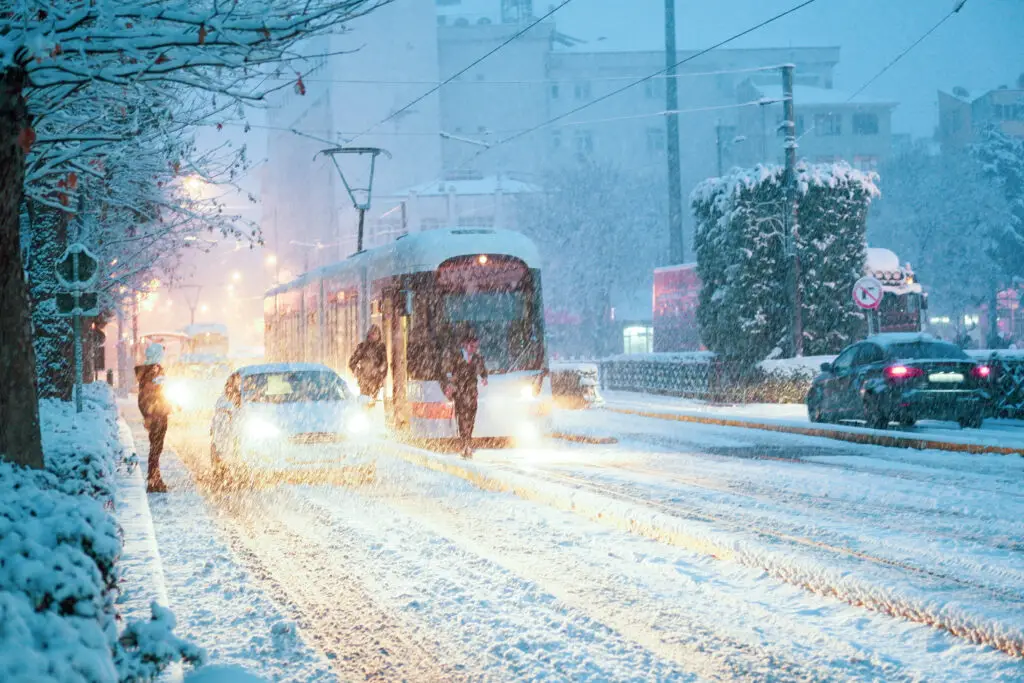 Weather is Snowing and There is Traffic Jam in the city center a